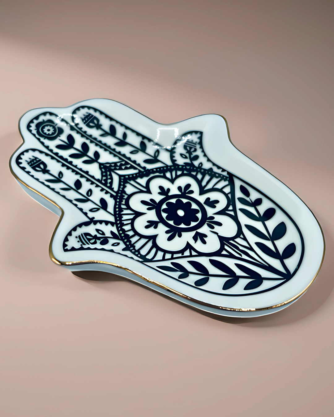 Decorative Hamsa hand with floral design on a beige background