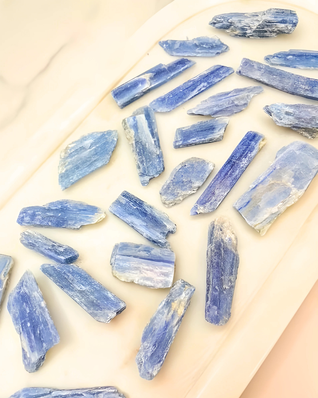 Blue crystal stones on a light beige surface