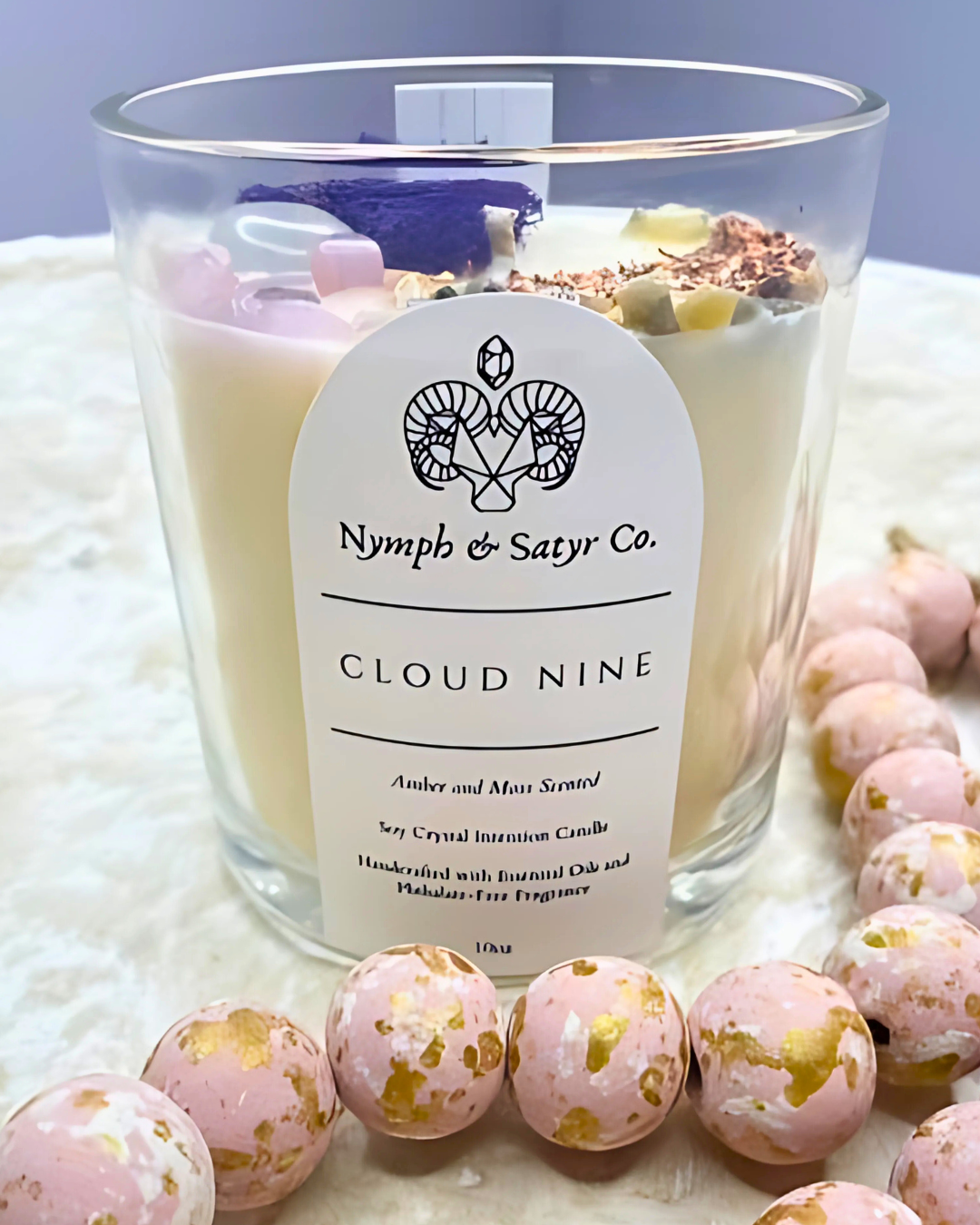 Cloud Nine Candle in clear glass jar with pink beads