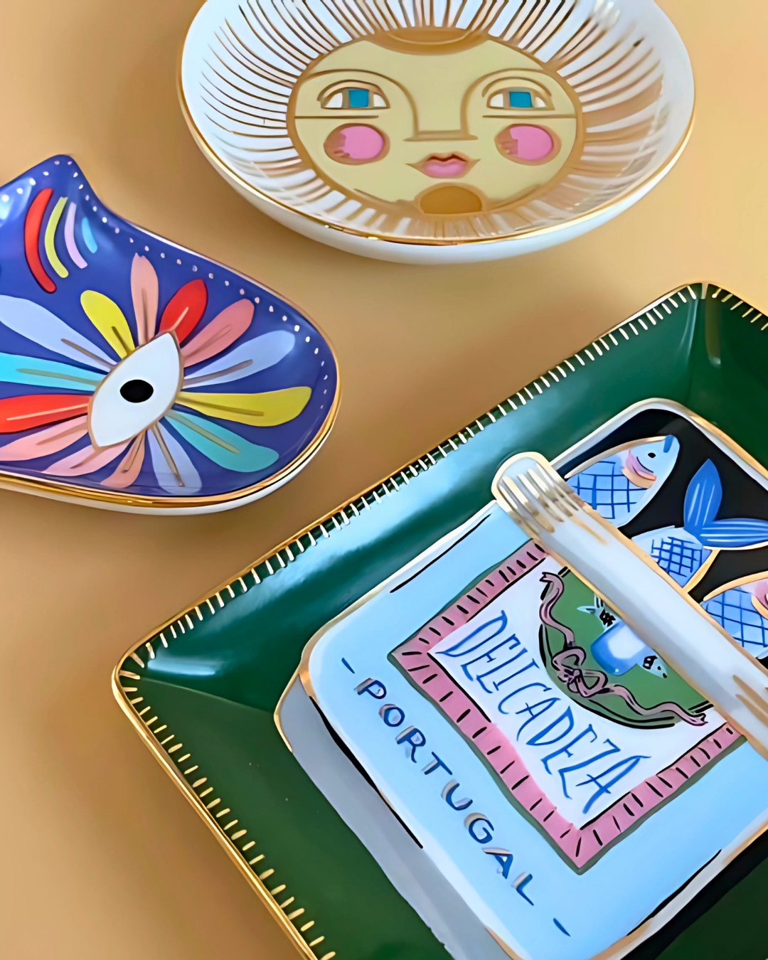 Decorative plates with artistic designs on a gold surface