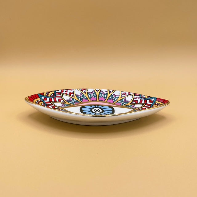 Discover the perfect balance of artistry and intention with the Blue Eye Red Pyramid Ceramic Trinket Tray.