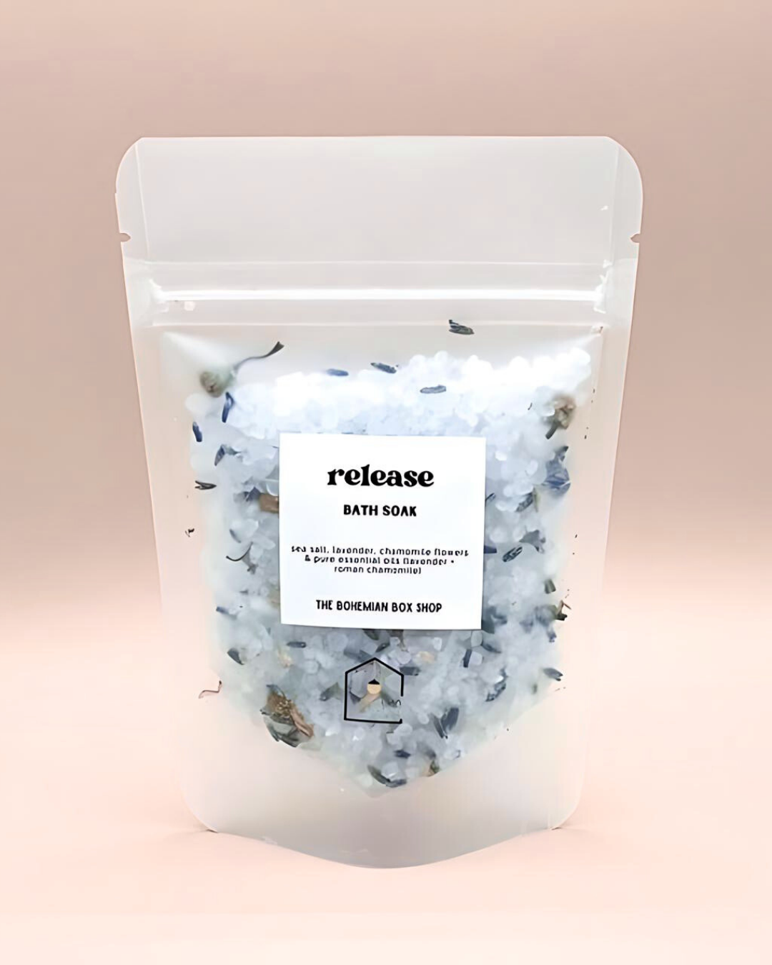 Bath soak package with 'release' label on a pink background