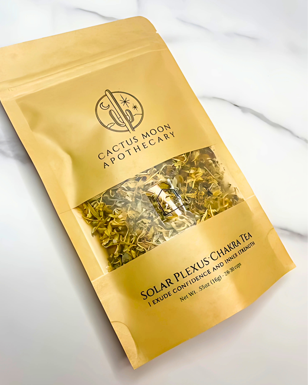 Yellow package of Solar Plexus Chakra Tea from Cactus Moon Apothecary on a white background