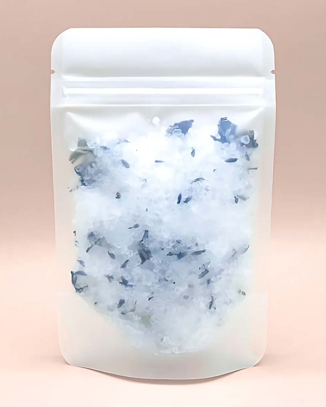 White packaging with blue specks on a beige background