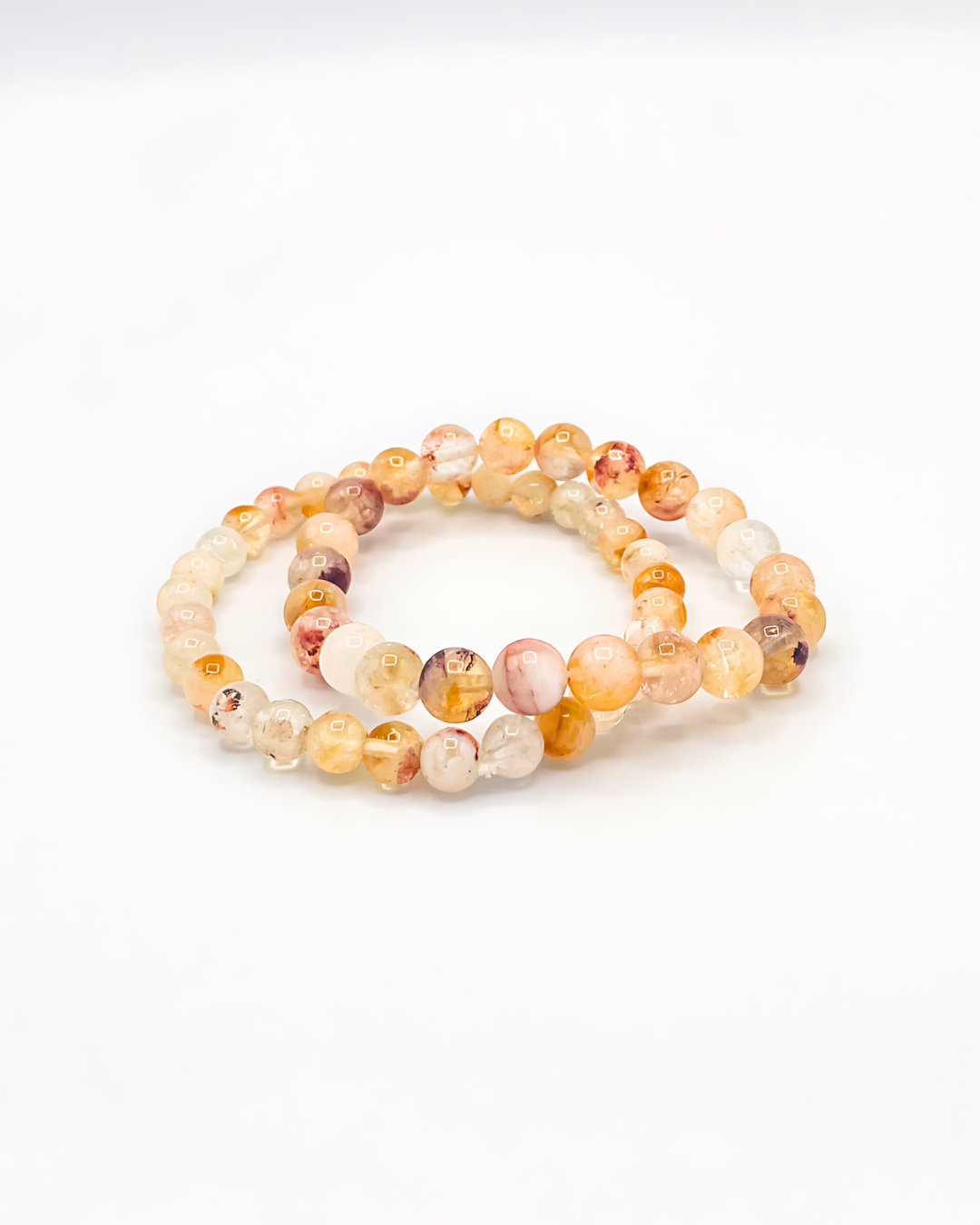 Set of two beaded bracelets on a white background