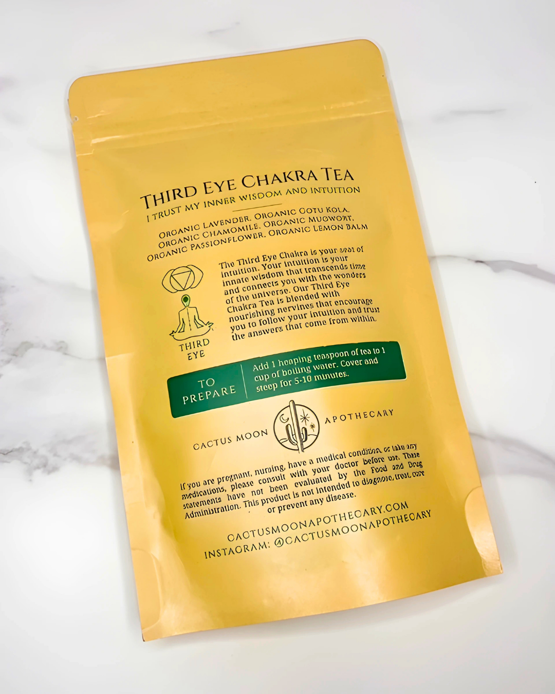 Yellow package of Third Eye Chakra Tea on a white background