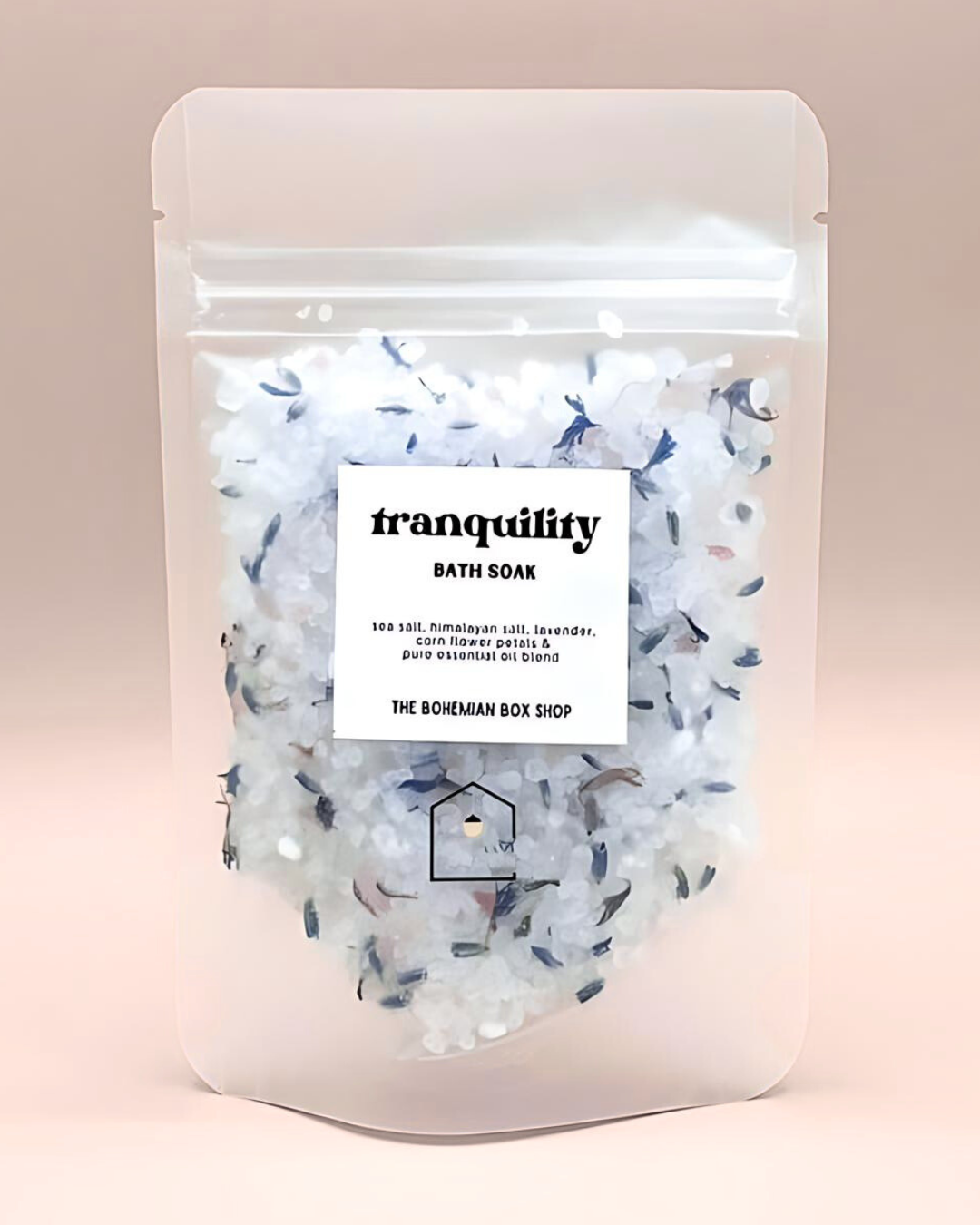 Bath soak packaging with 'tranquility' label on a pink background