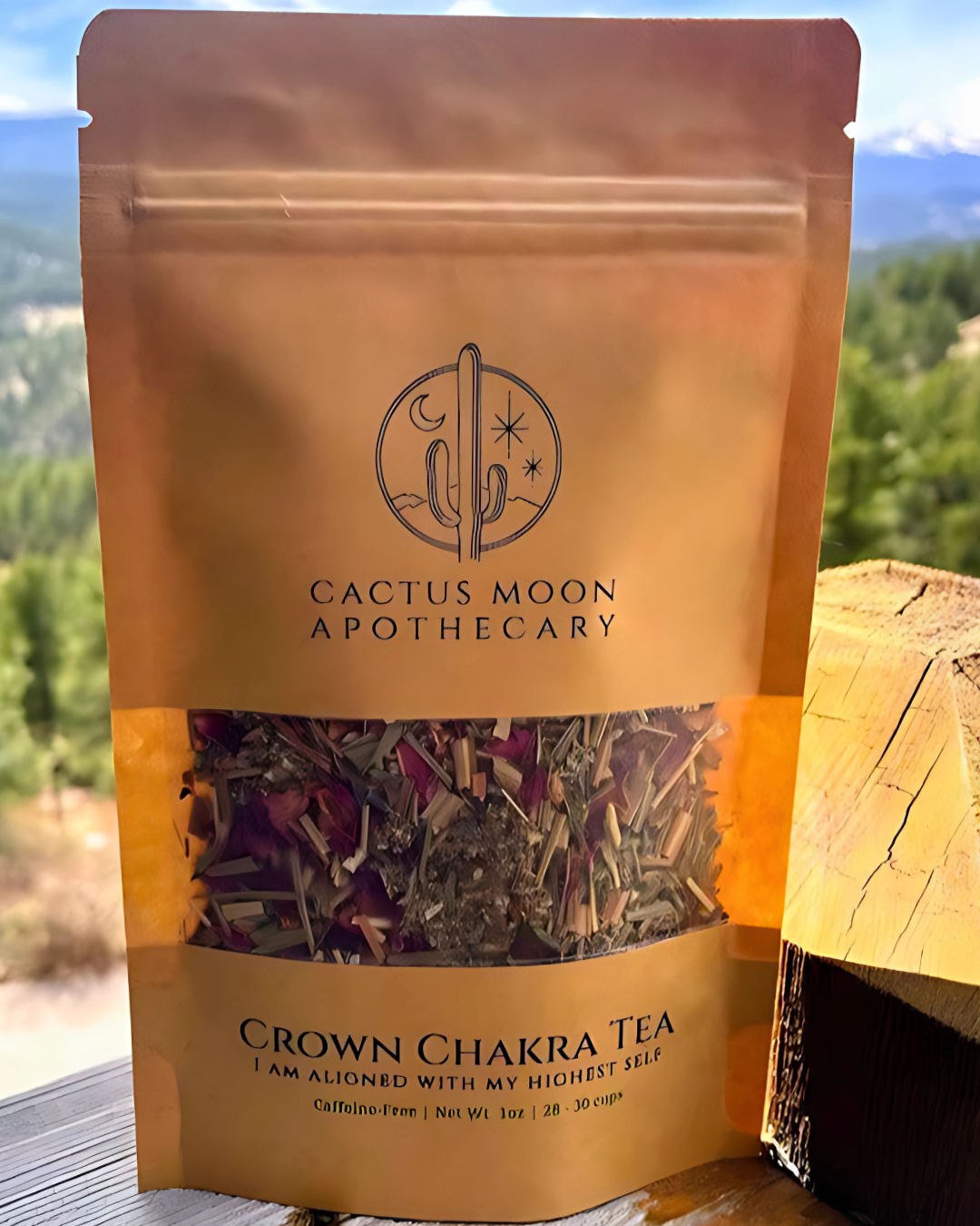 Cactus Moon Apothecary Crown Chakra Tea package with a scenic background