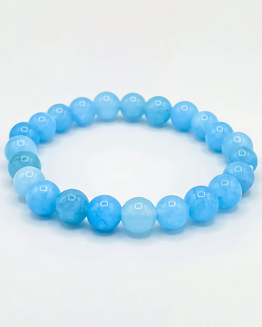 Blue beaded bracelet on a white background