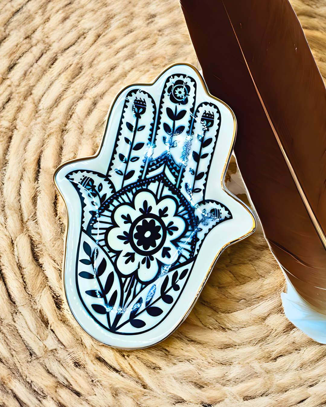 Decorative Hamsa hand sticker with intricate patterns on a textured surface