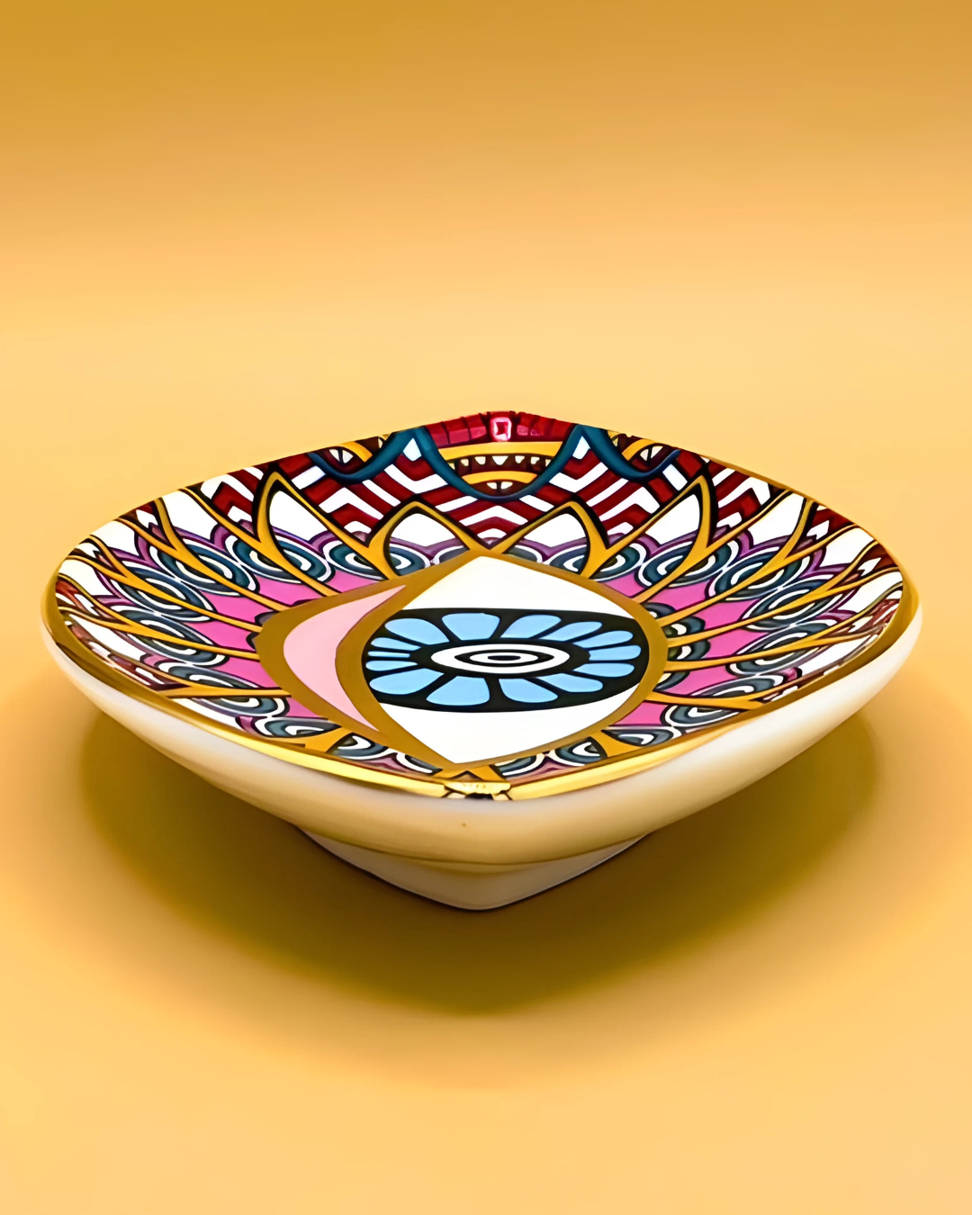 Decorative soap dish with colorful pattern on a yellow background