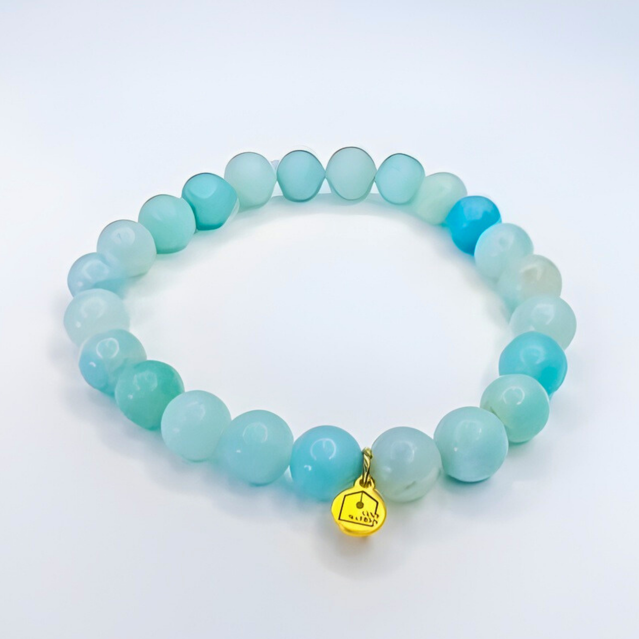 amazonite bead bracelet with charm white background