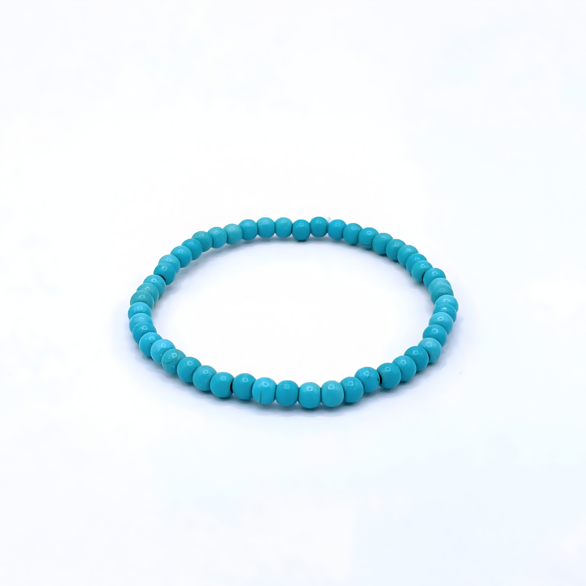 Turquoise beaded bracelet on a white background