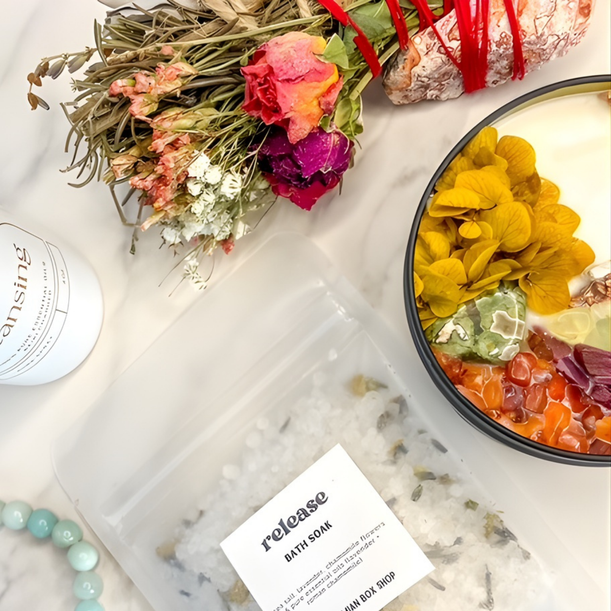 Bath soap labeled 'Release' with flowers and a candle on a marble surface