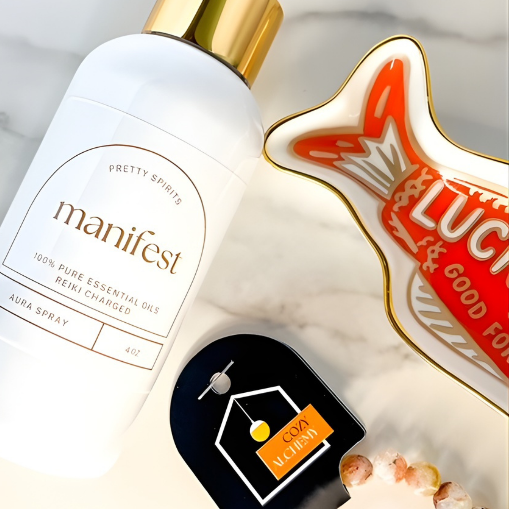 Essential oil spray bottle labeled 'manifest' with a decorative item featuring 'Luci' on a neutral background.