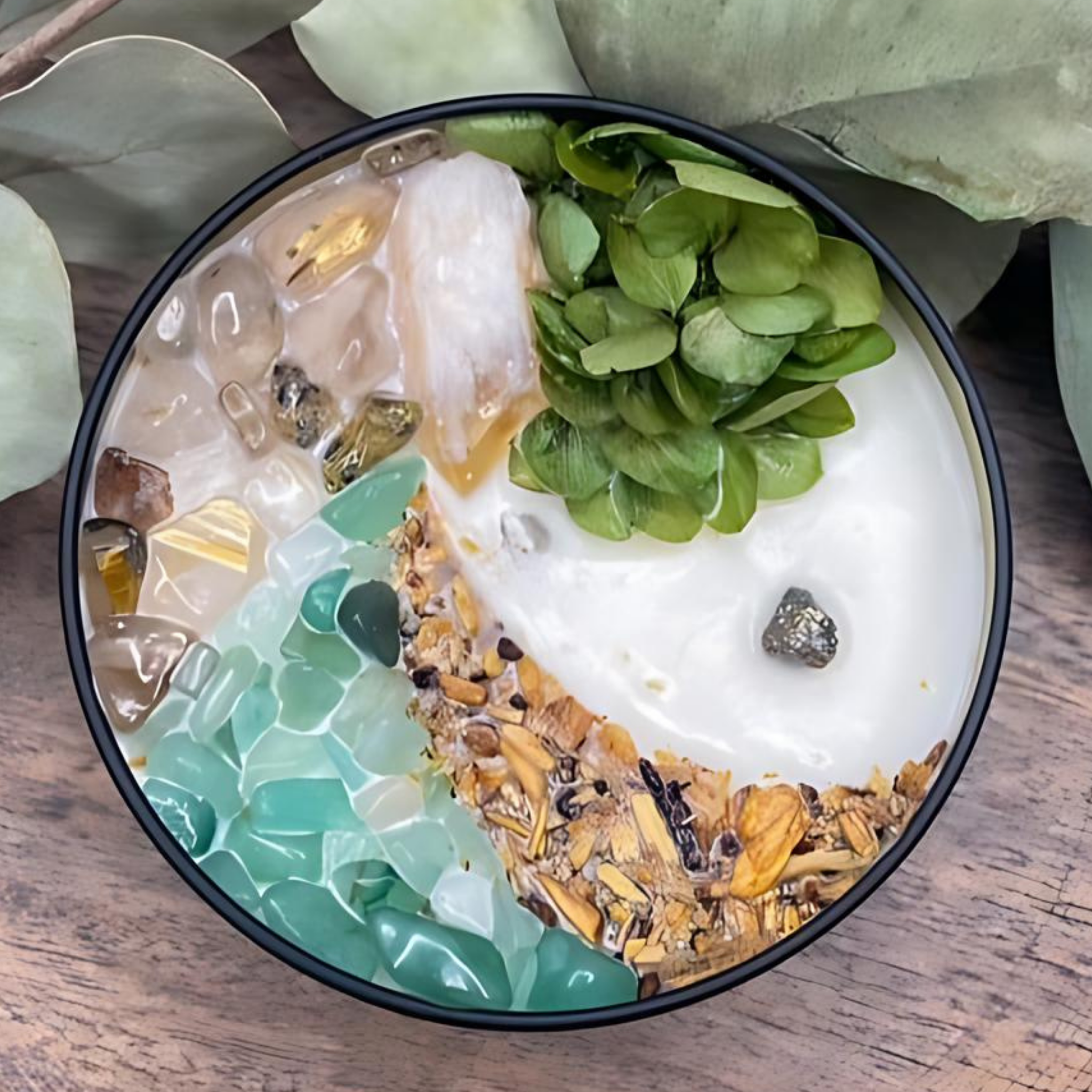Decorative bowl with green and white design on a wooden surface