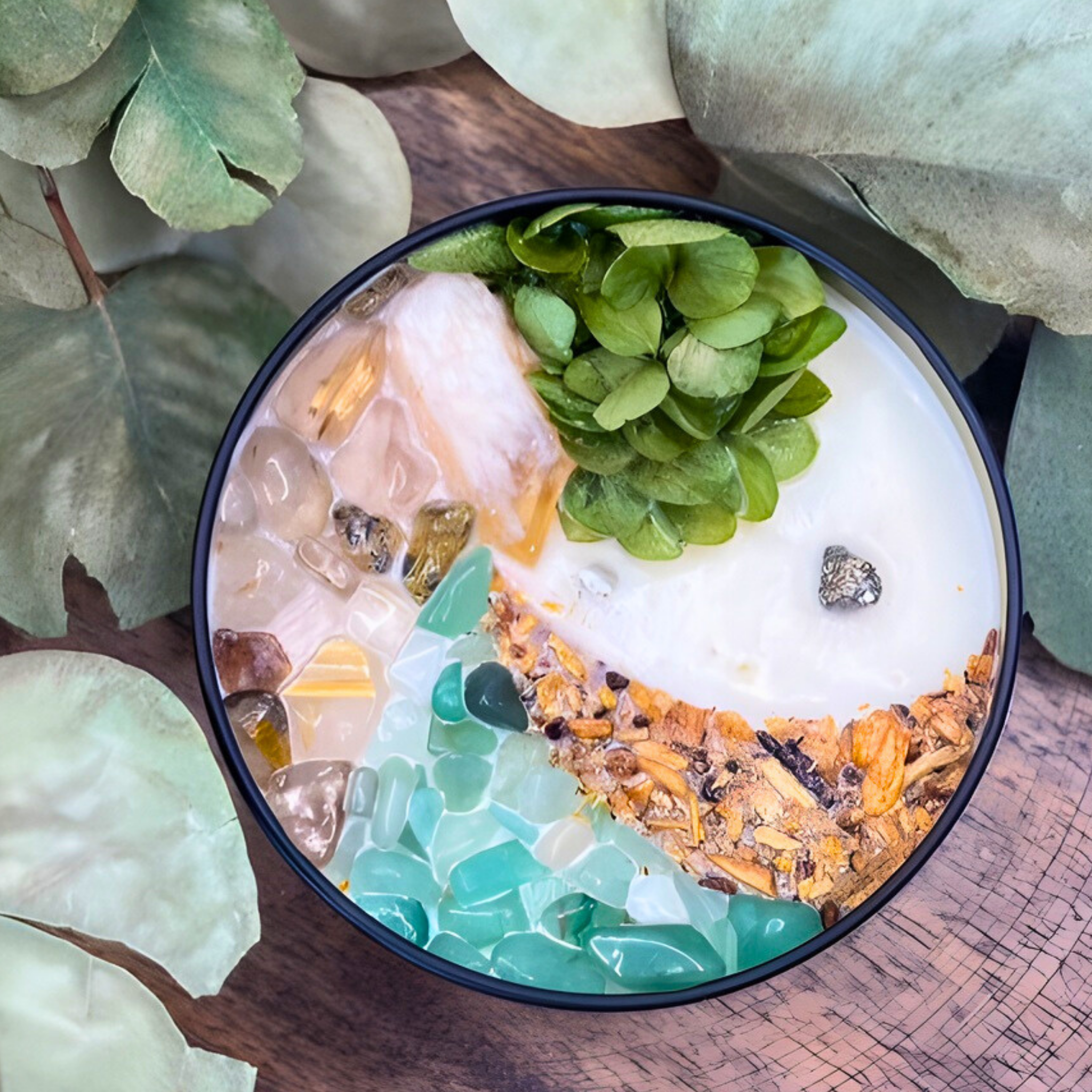 Bowl with a dessert-like mixture on a wooden surface with green leaves.