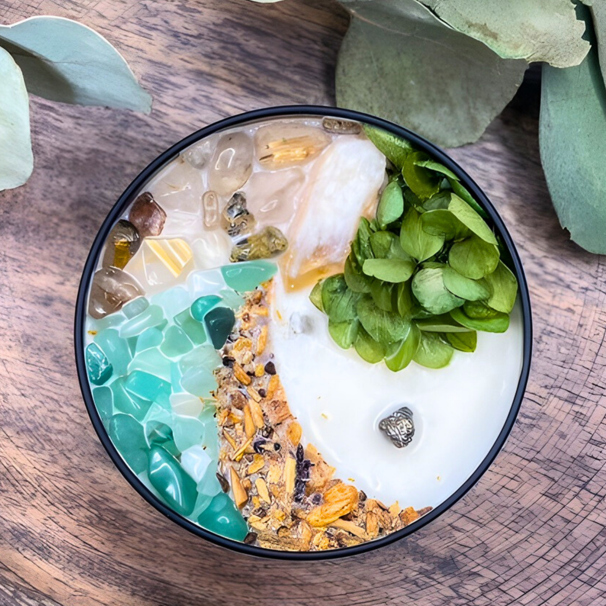 Decorative bowl with green and gold elements on a wooden surface