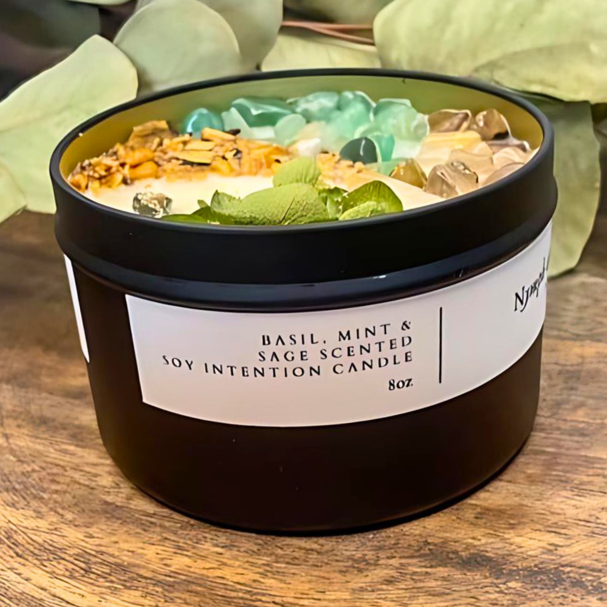 Scented candle with decorative elements on a wooden surface