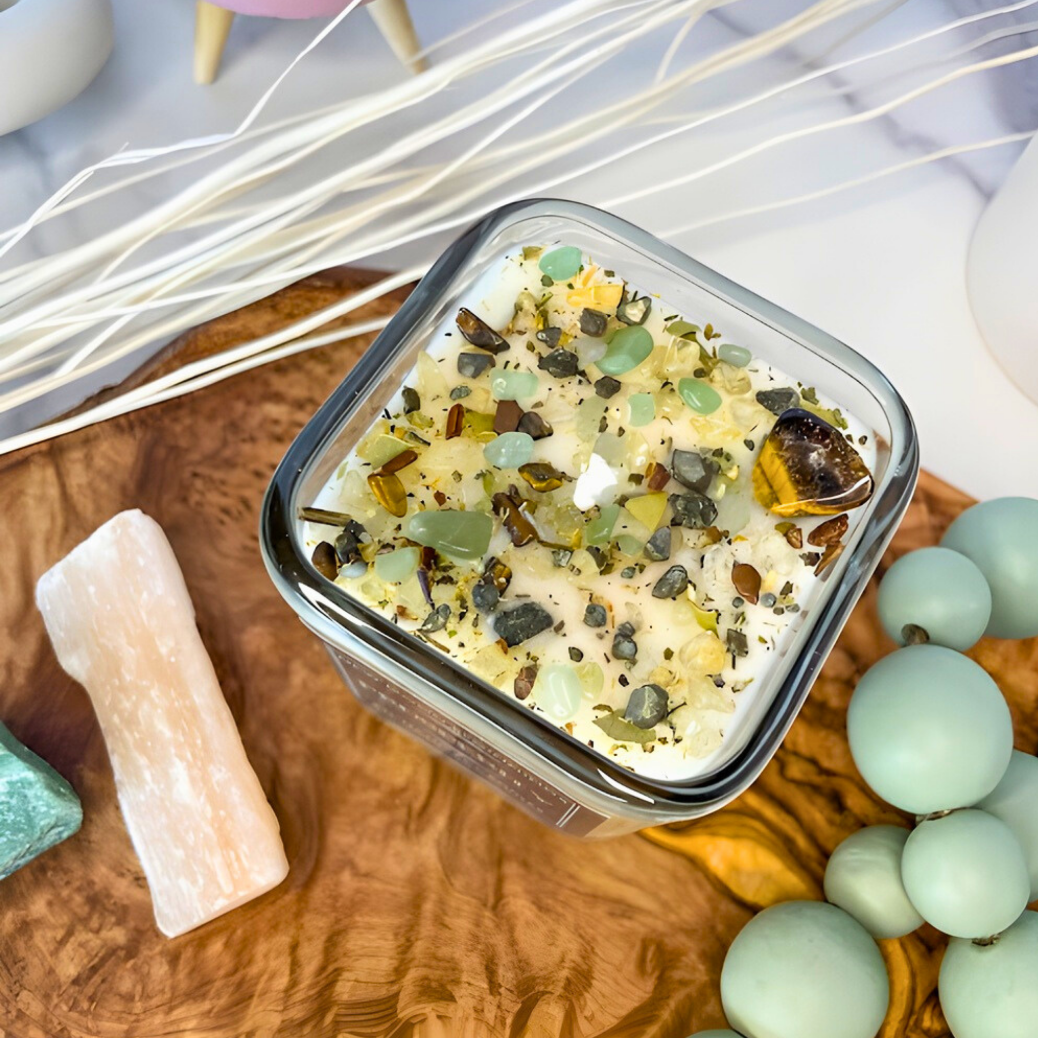 Container of bath salts with decorative elements on a wooden surface