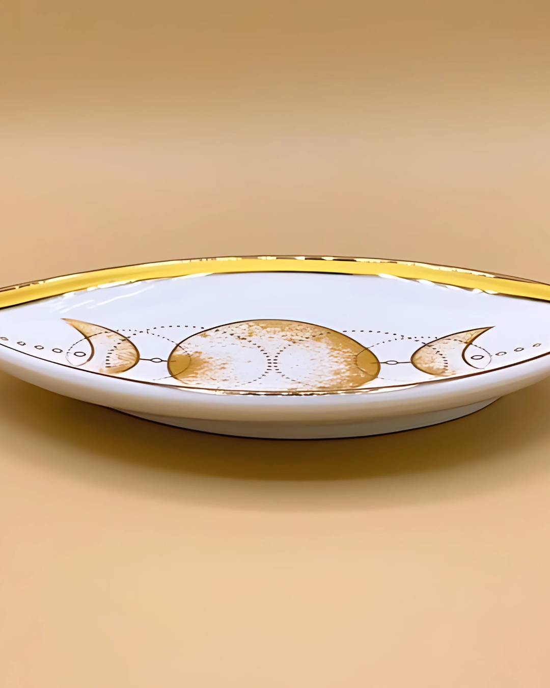 Decorative plate with gold accents on a beige background