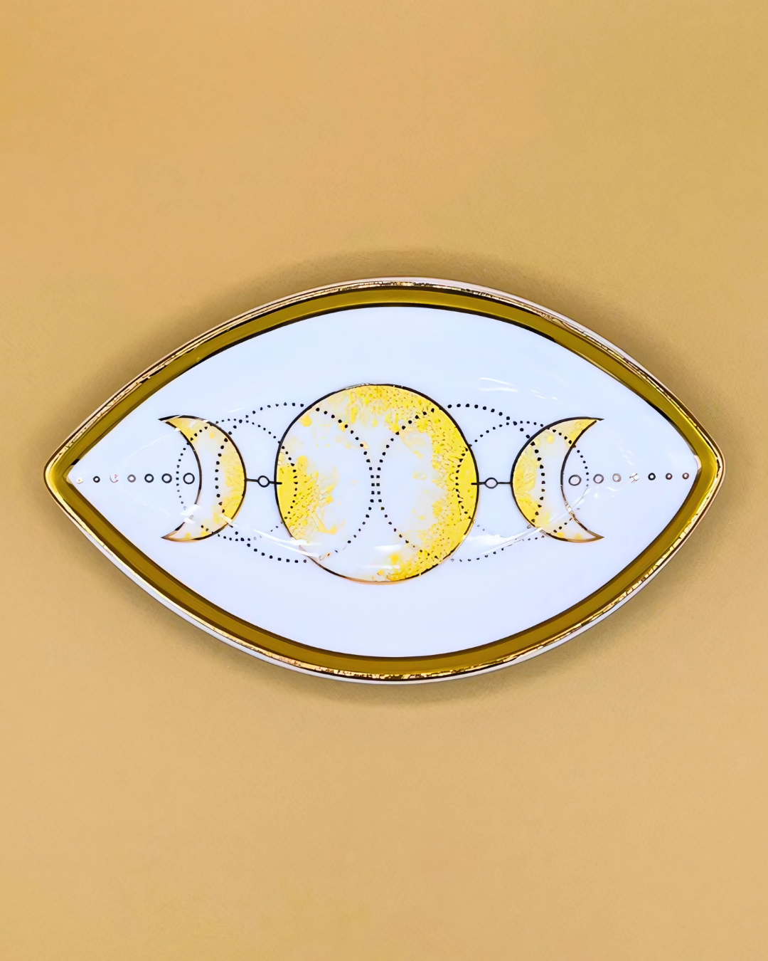 Decorative plate with moon phases design on a beige background