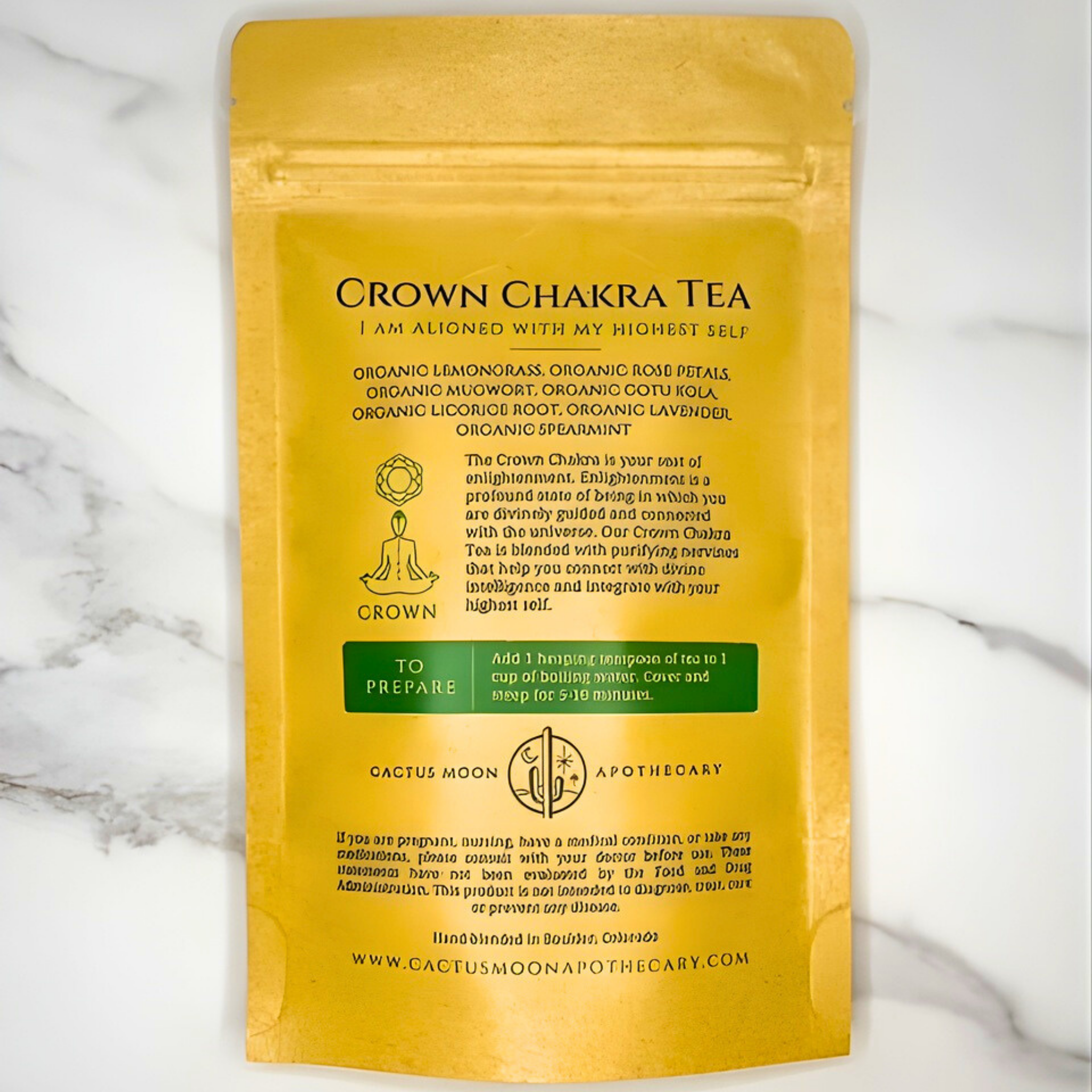 Yellow package of Crown Chakra Tea with text on a marble background