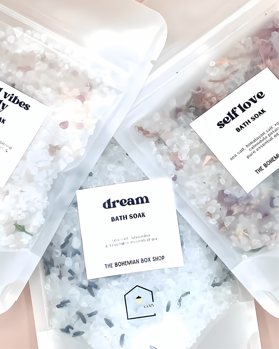 Bath soaks with labeled packaging on a light surface