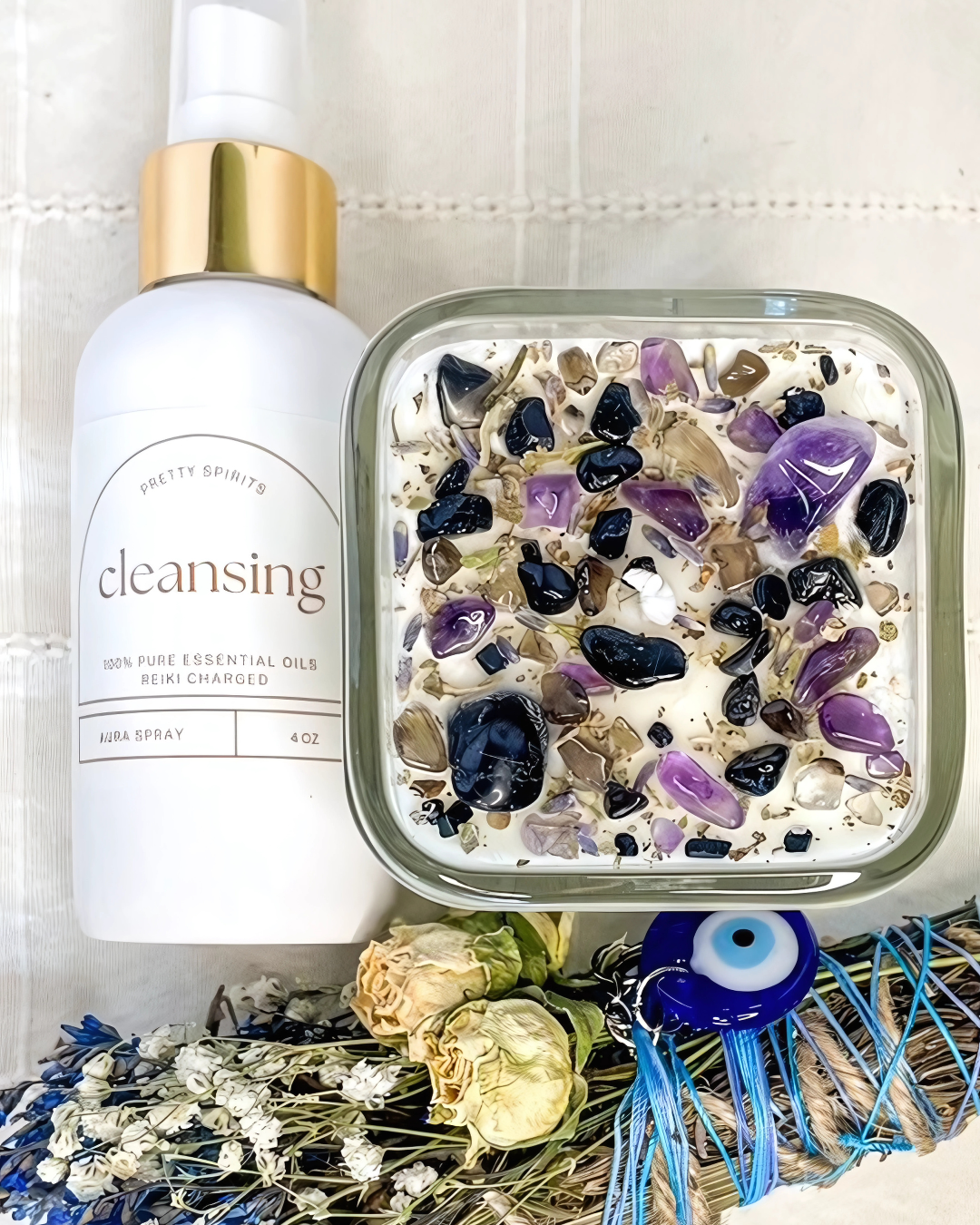 Cleansing bottle with a decorative container filled with stones and crystals on a white background