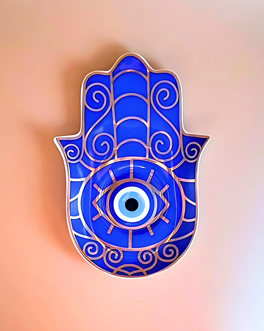 Blue Hamsa hand with an eye design on a gradient background