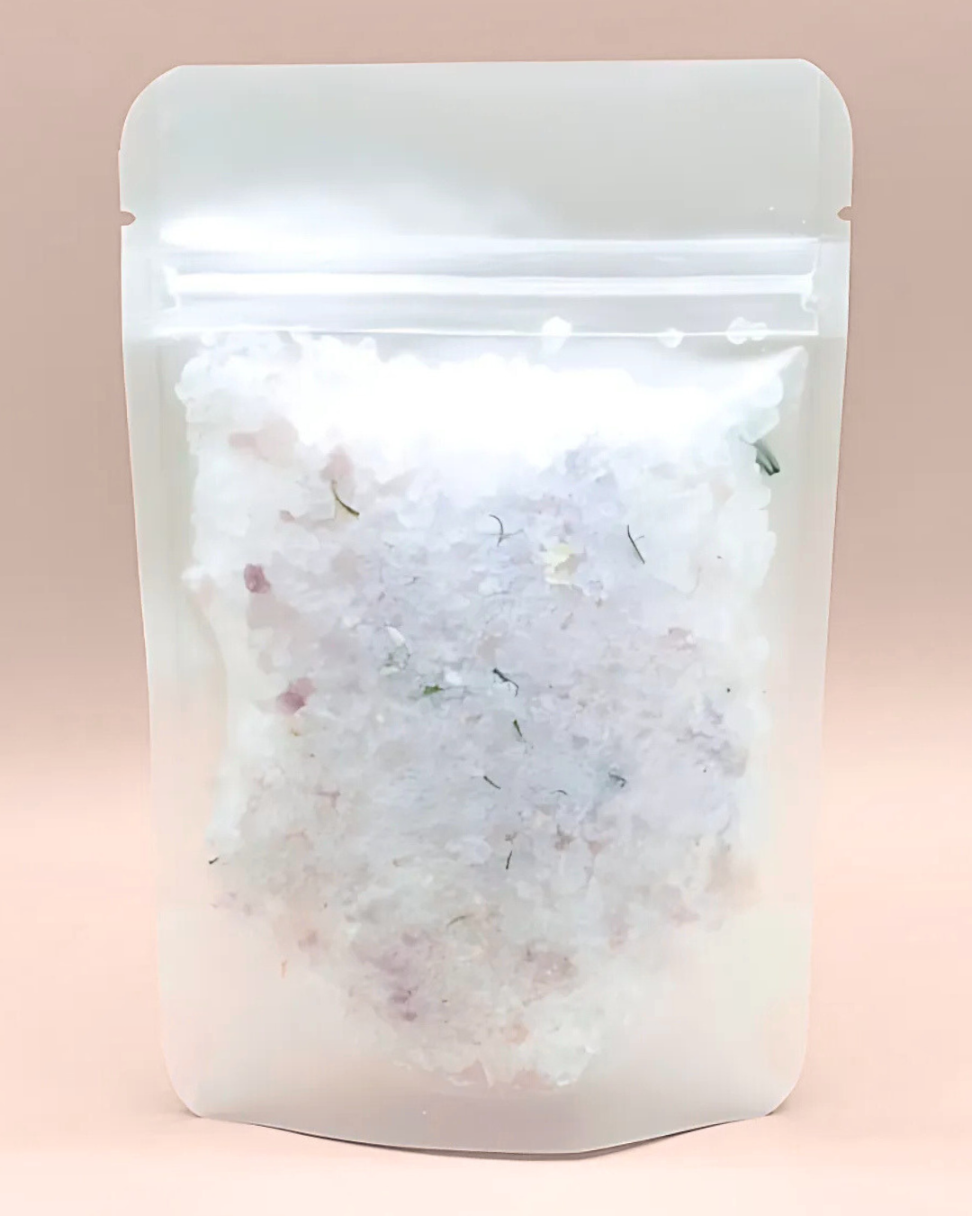 Clear plastic bag with a white powdery substance on a pink background