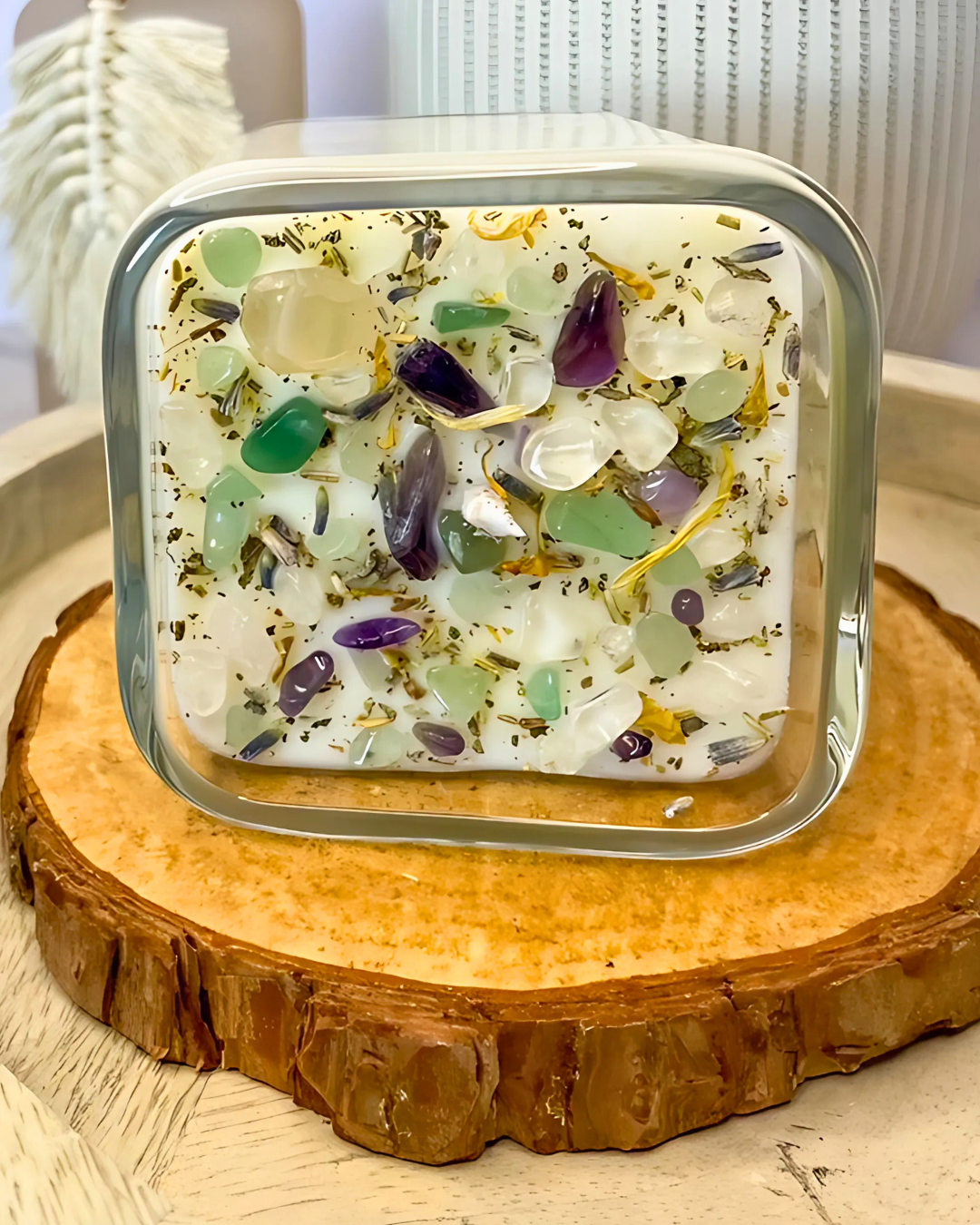 Square glass container with decorative stones on a wooden surface