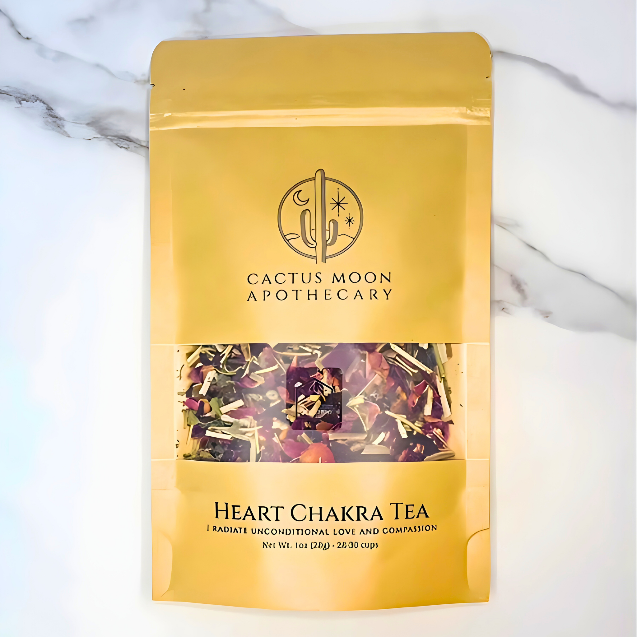 Yellow package of Cactus Moon Apothecary Heart Chakra Tea on a marble background