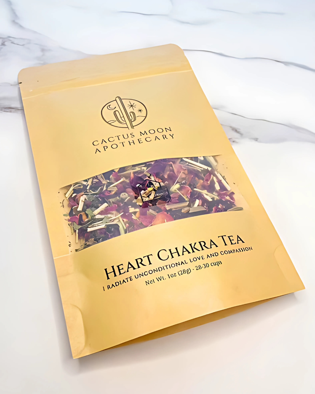 Gold package of Cactus Moon Apothecary Heart Chakra Tea on a white background