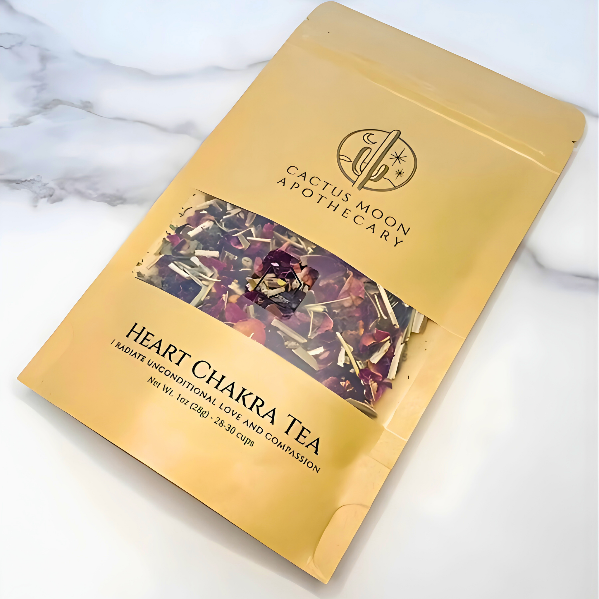Yellow package of Heart Chakra Tea from Cactus Moon Apothecary on a marble surface