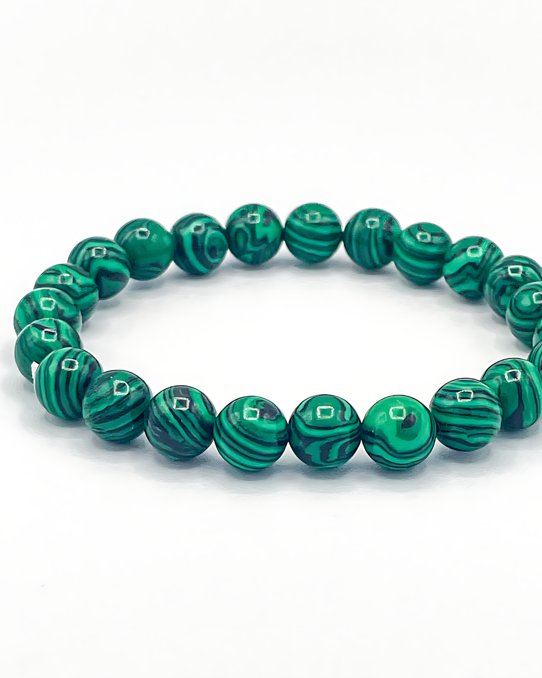 Green beaded bracelet on a white background