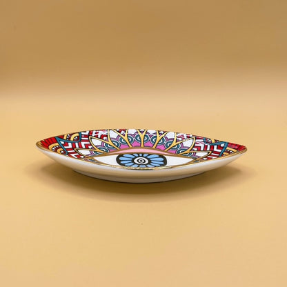 Discover the perfect balance of artistry and intention with the Blue Eye Red Pyramid Ceramic Trinket Tray.
