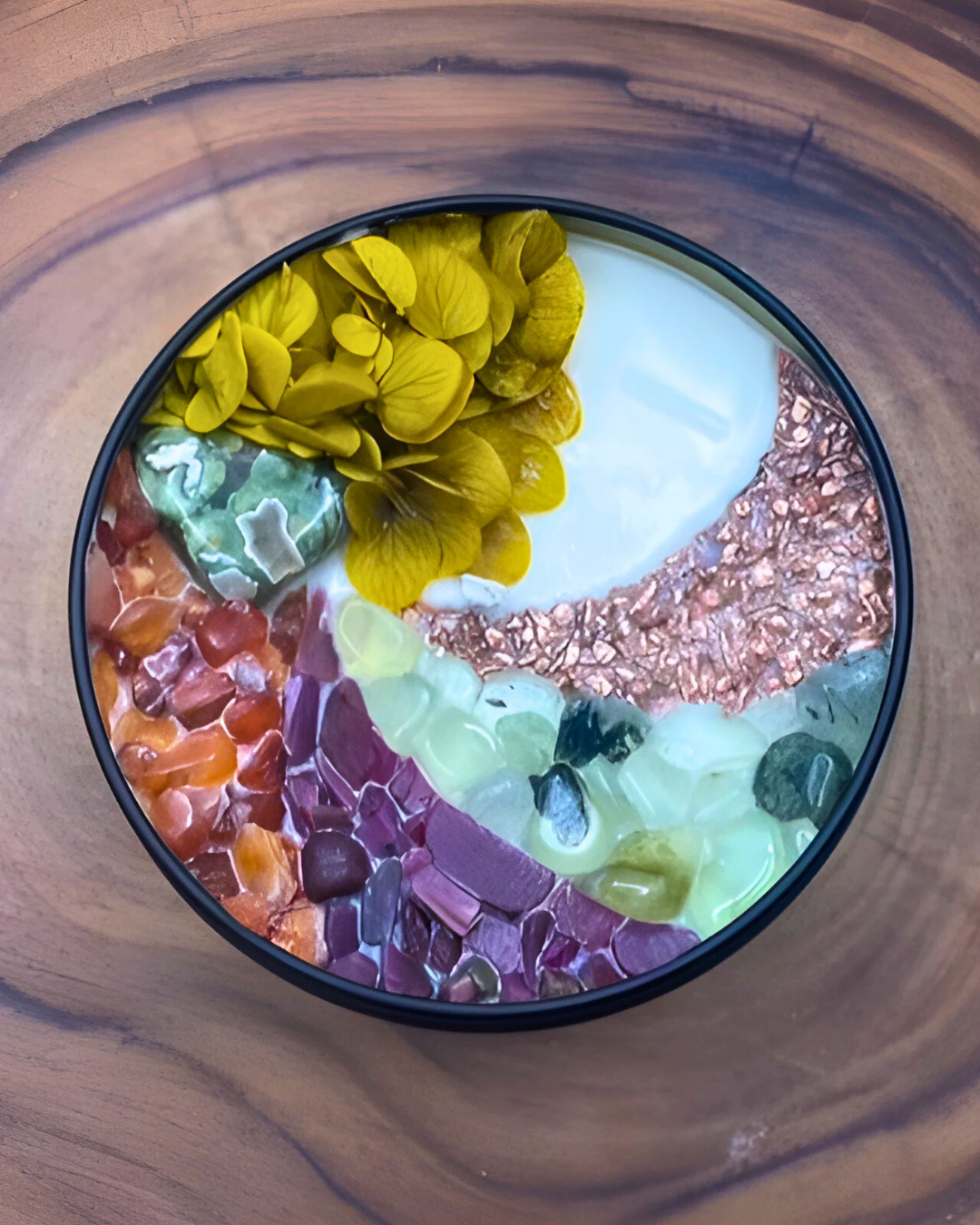 Colorful layered dessert with flowers on a wooden surface
