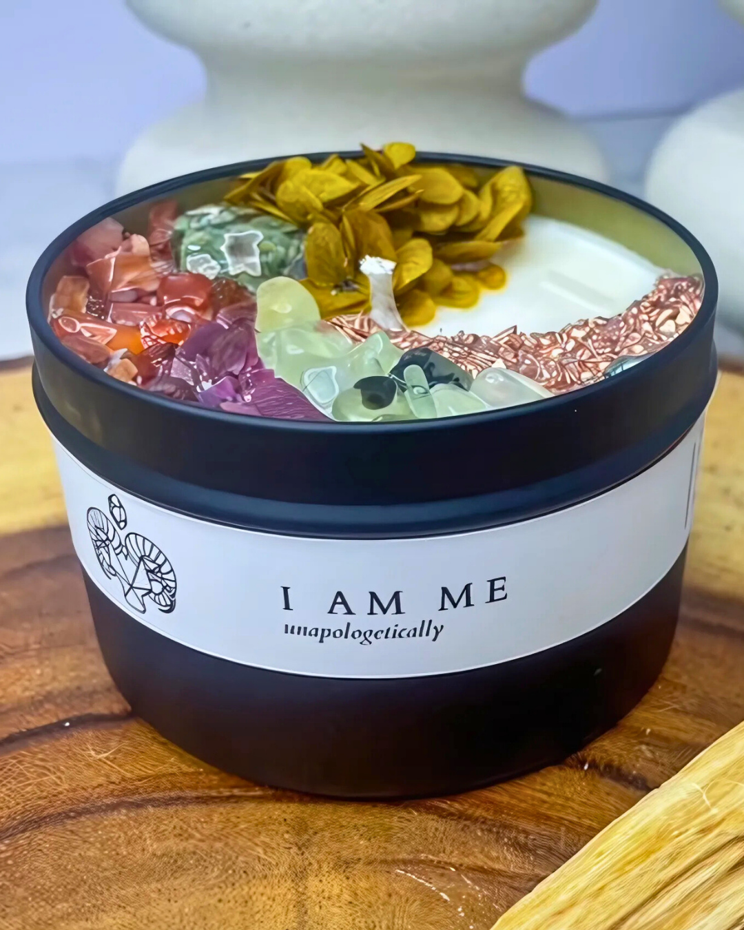 Jar with colorful contents and 'I AM ME unapologetically' label on a wooden surface