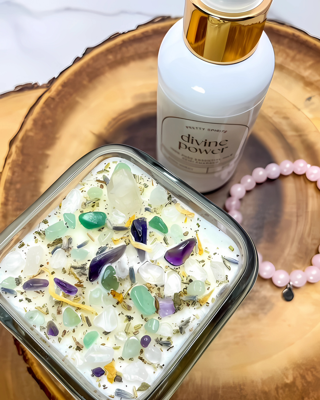 Container of crystals with a bottle labeled 'divine power' on a wooden surface.