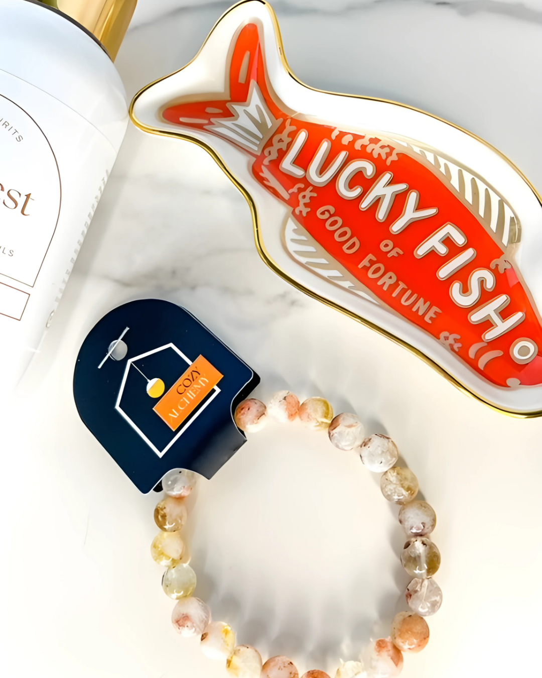 Lucky Fish branded product with a bracelet and keychain on a white background