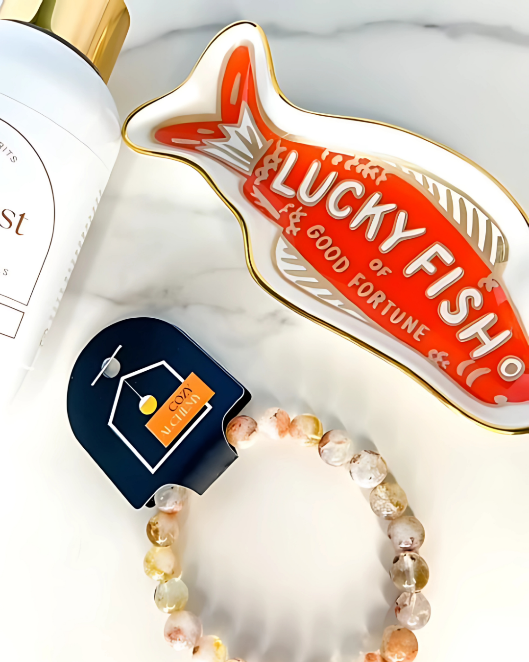 Lucky Fish product with a bracelet and tag on a white background