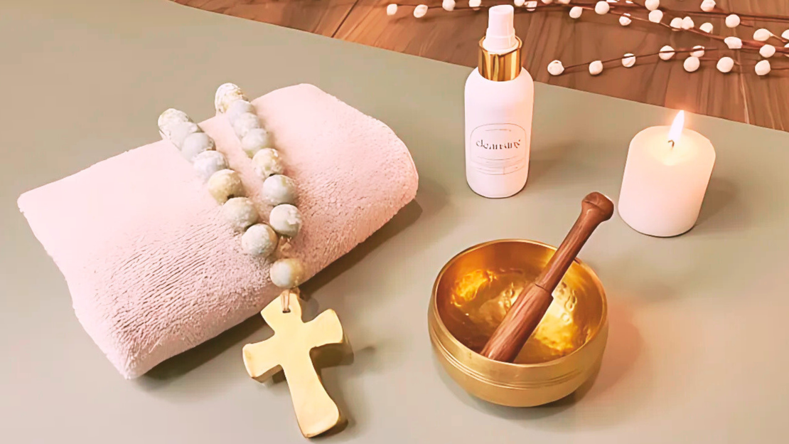 Yoga mat, towel, meditation mala prayer beads, singing bowl, cleanings aura spray and candle