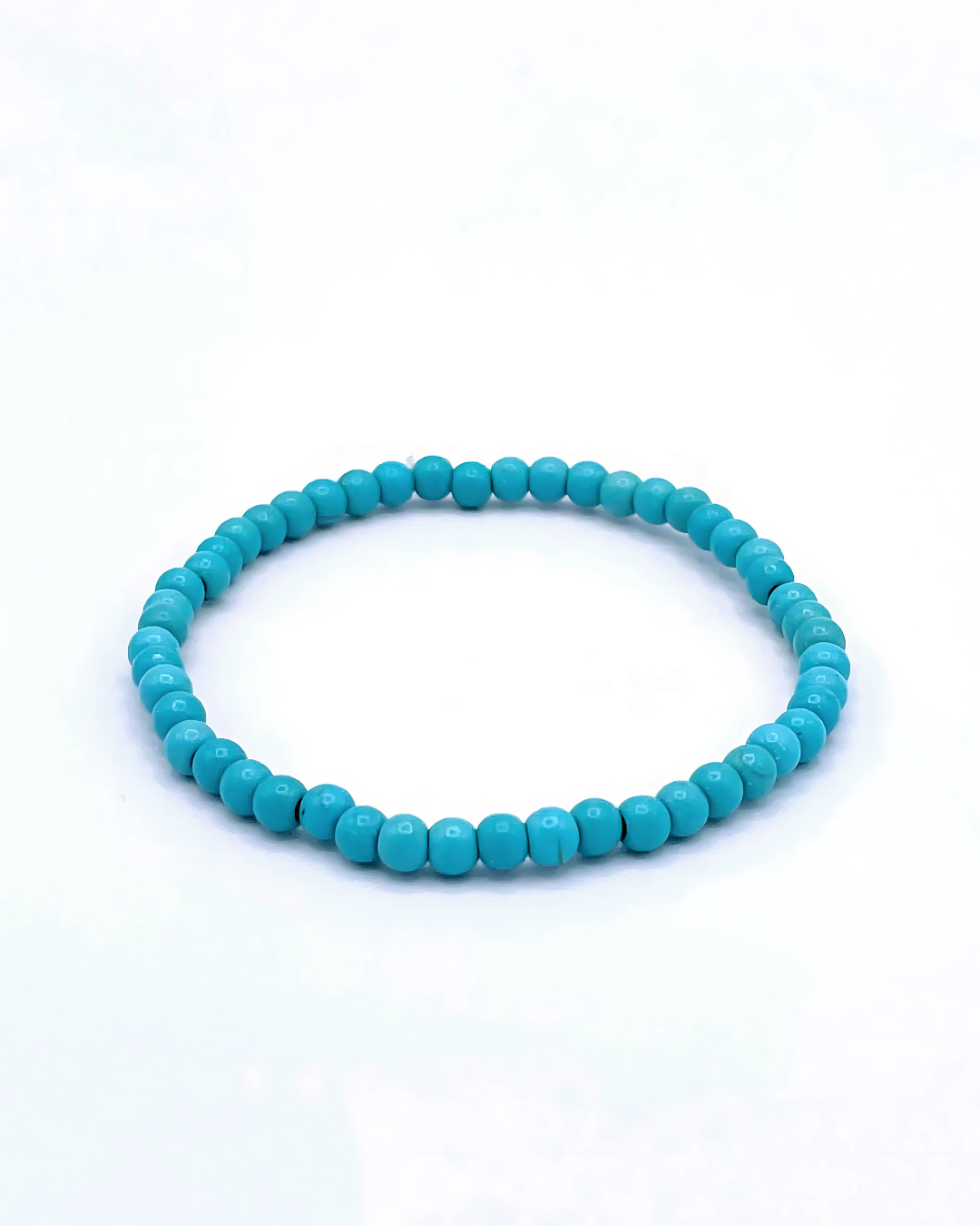 Turquoise beaded bracelet on a white background