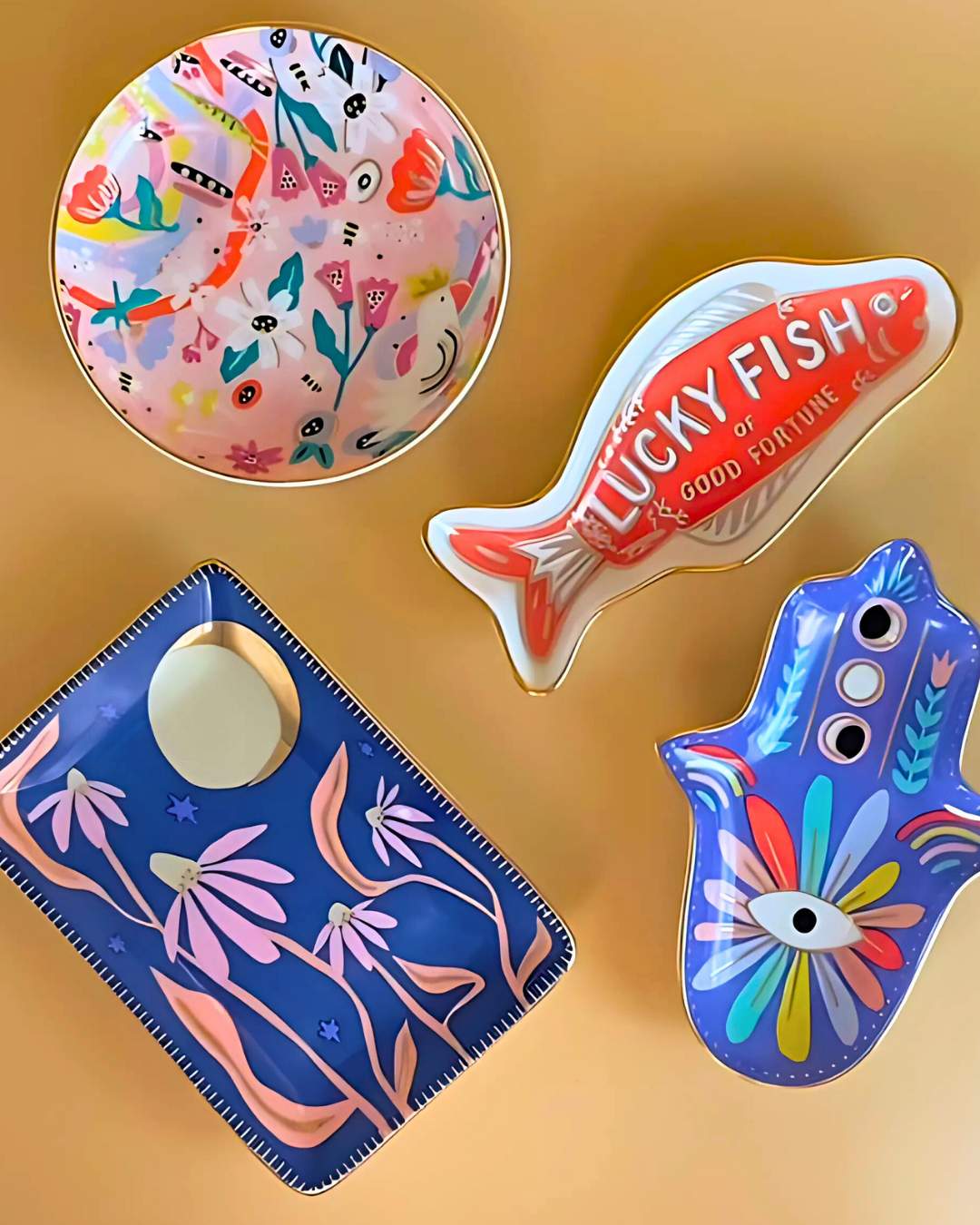 Four colorful decorative items on a yellow background