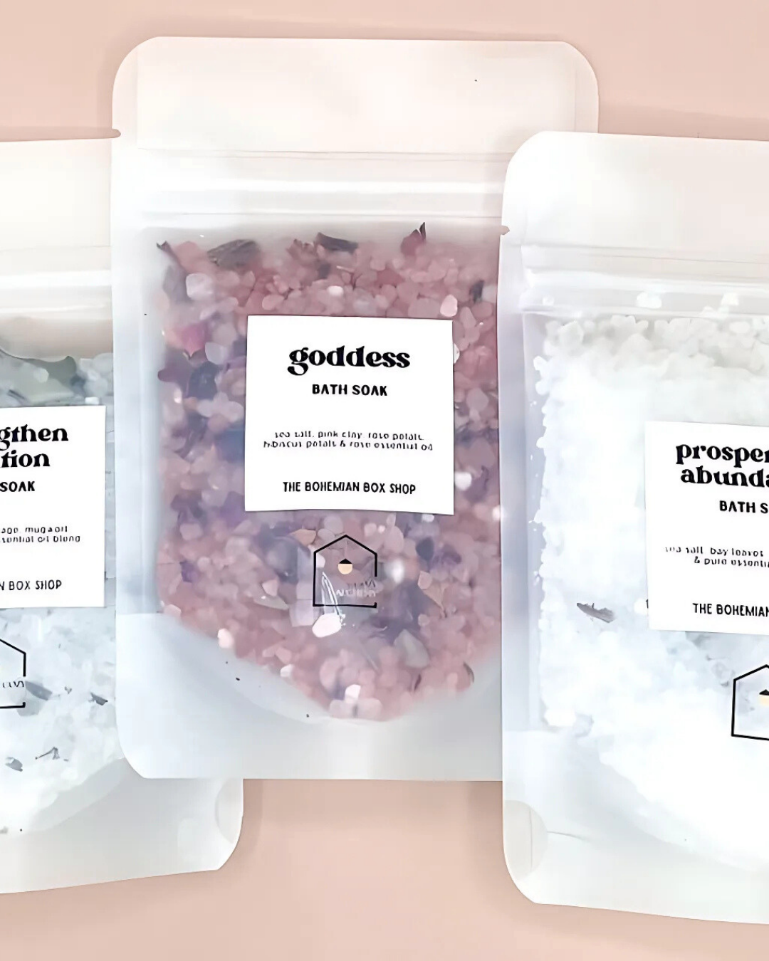 Bath soaks with visible labels on a pink background