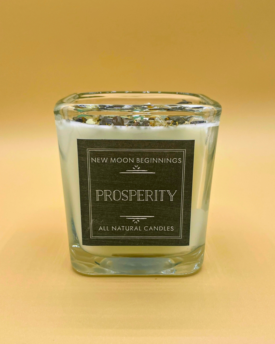 Candle with a label on a yellow background