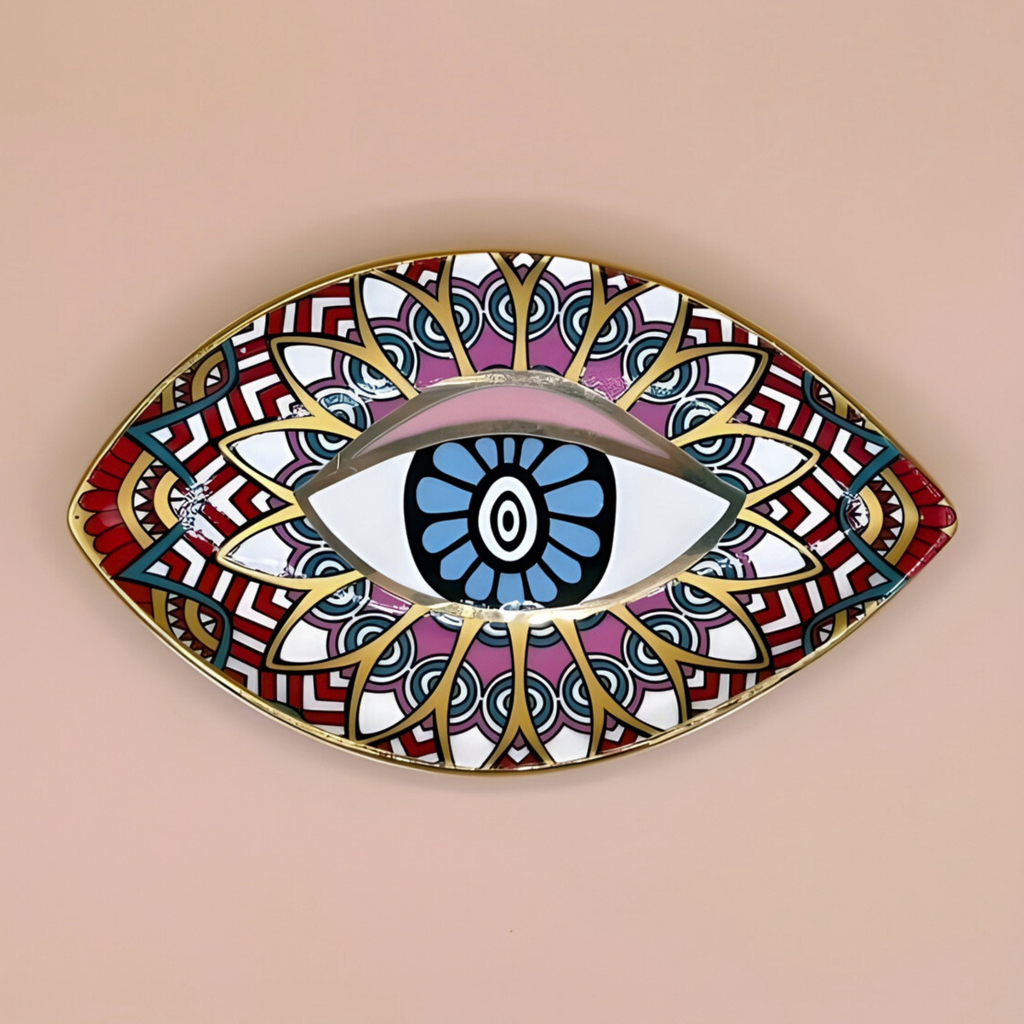 Decorative wall art piece shaped like an eye with colorful patterns on a beige background