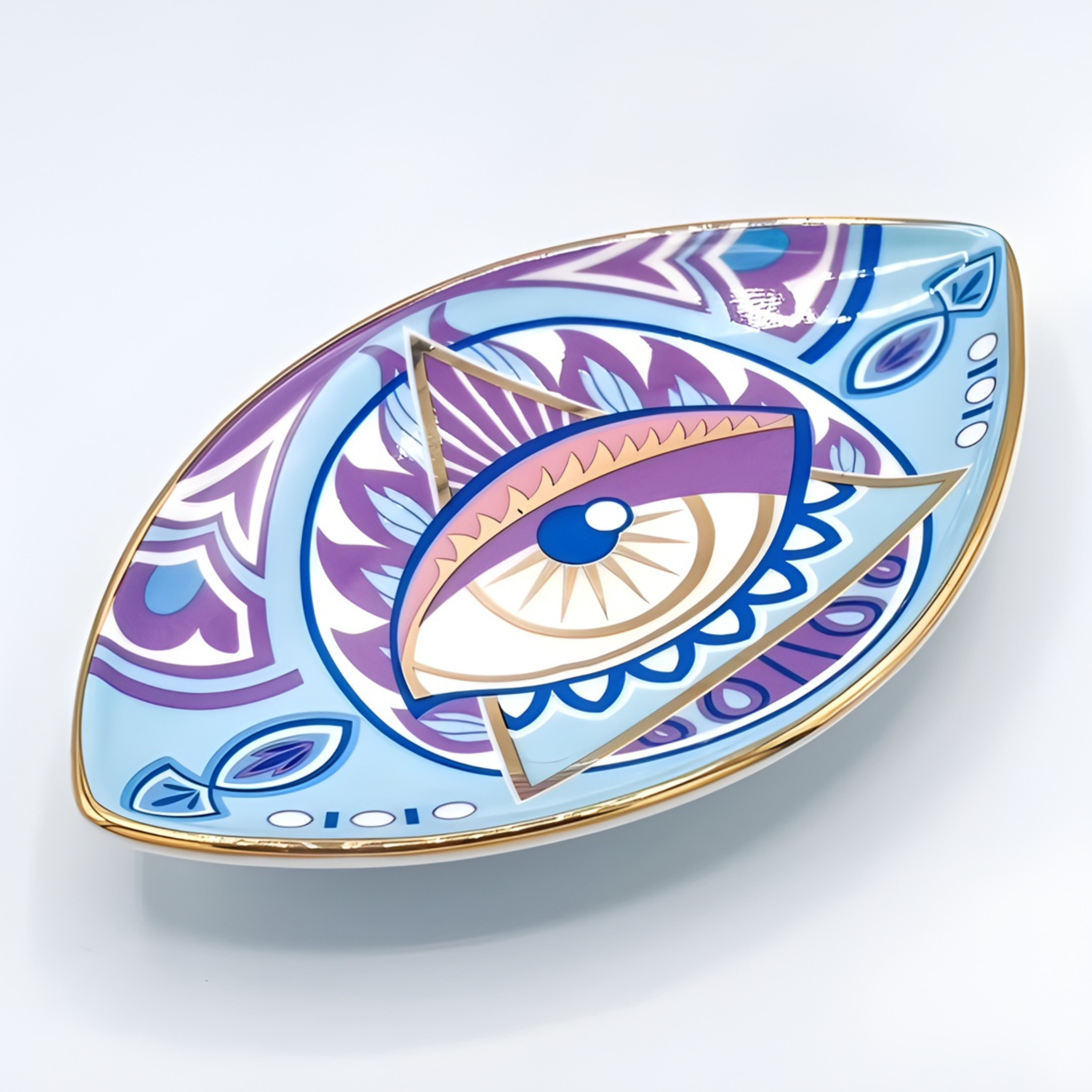 Decorative plate with eye design on a light blue background