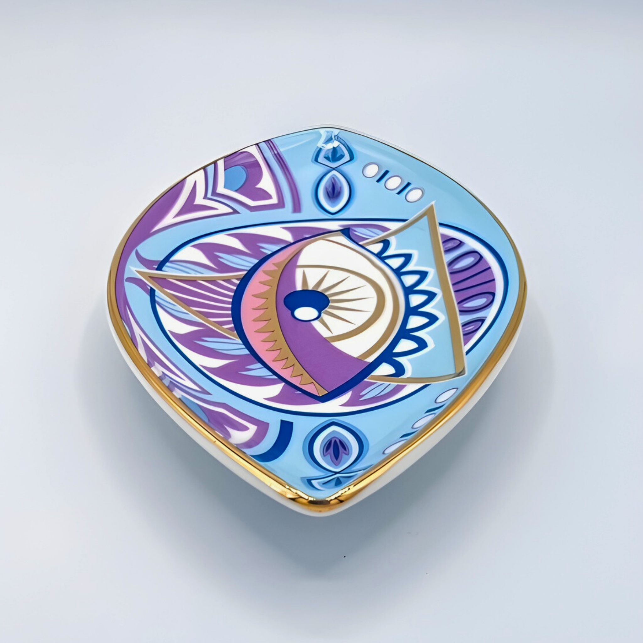 Decorative heart-shaped object with geometric patterns on a light gray background